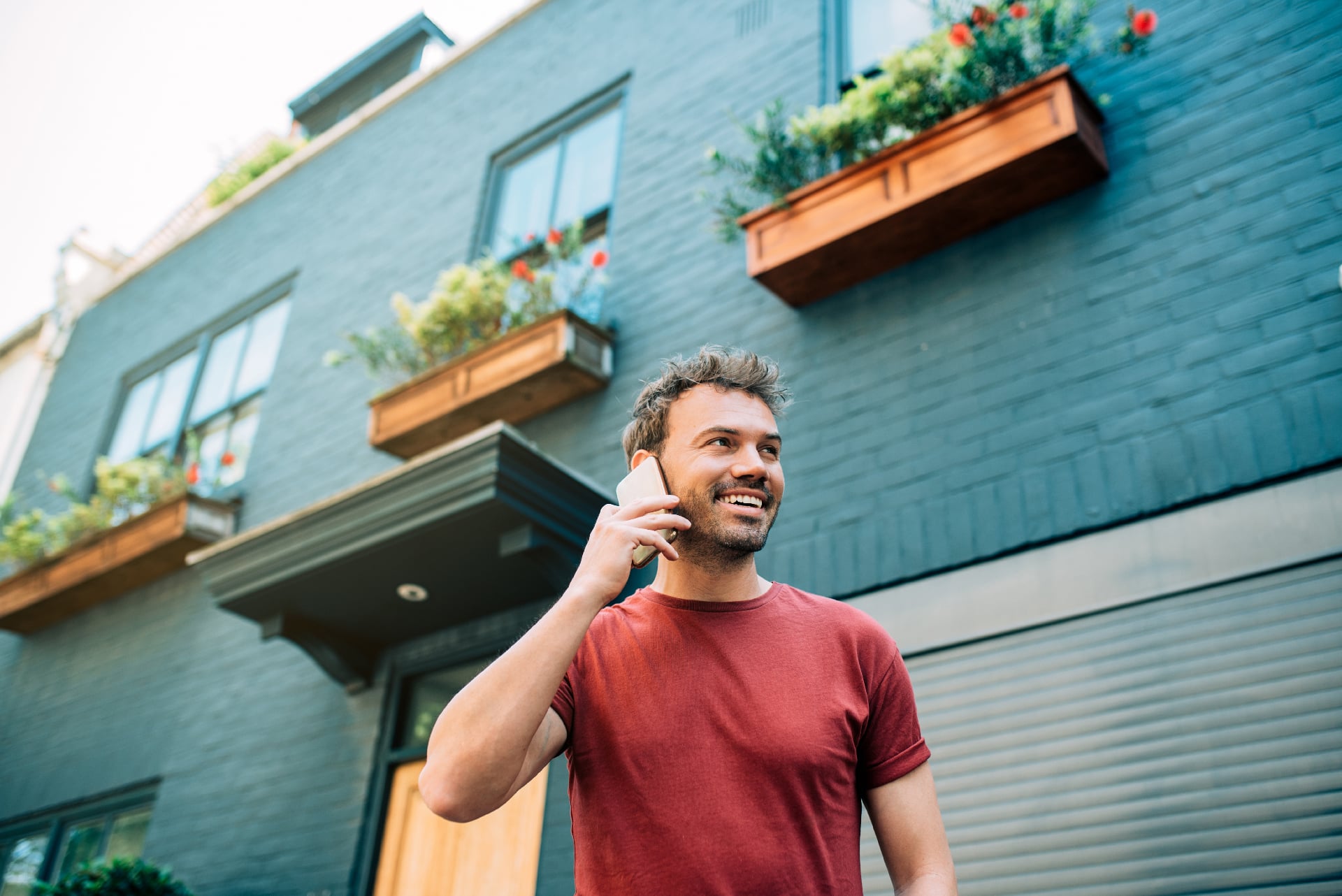 Man holding phone in street